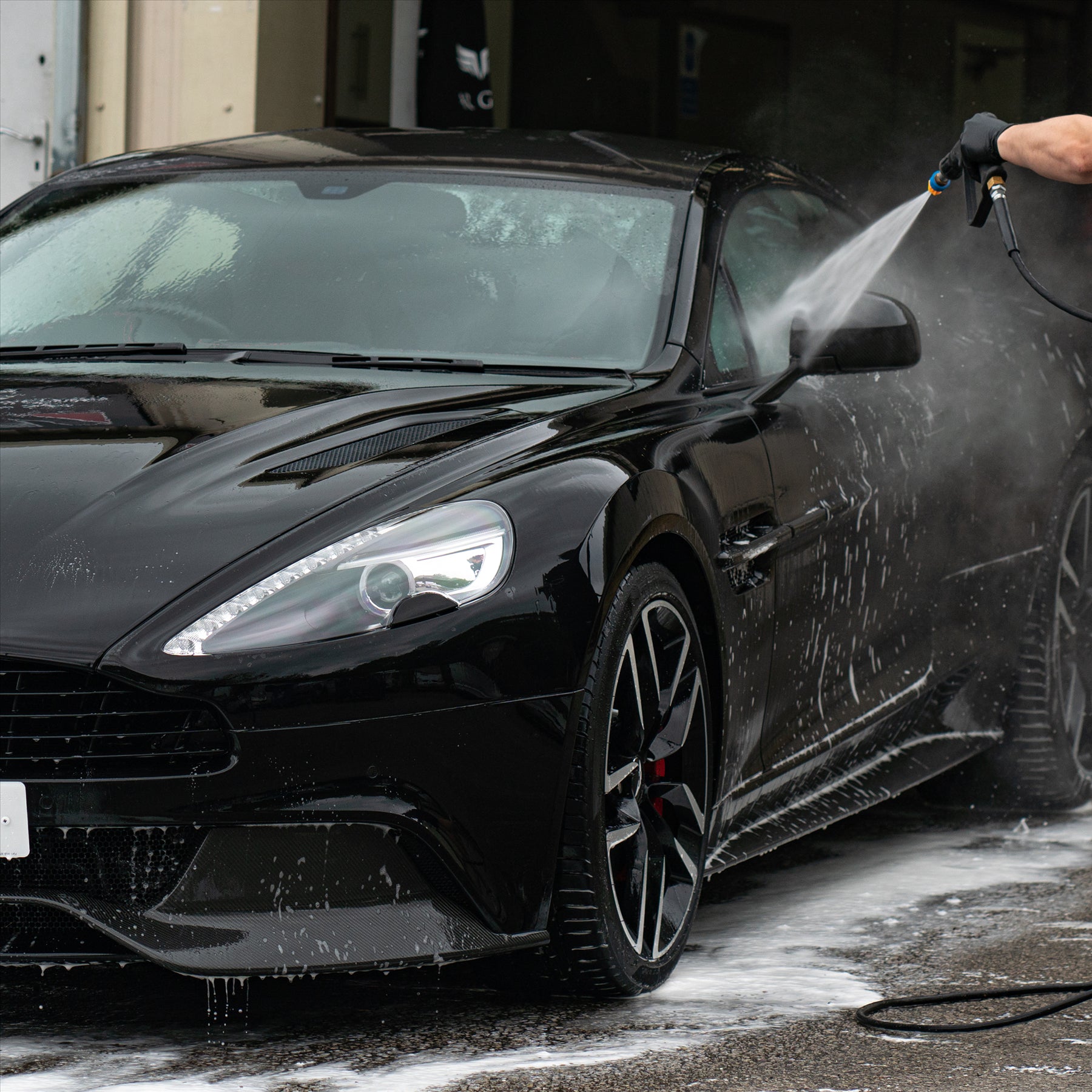 Almighty power pre wash being cleaned off a car
