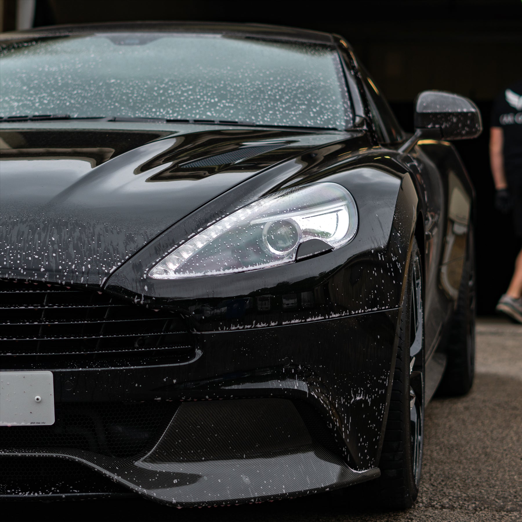 Aston Martin with bug and sap remover sprayed onto it