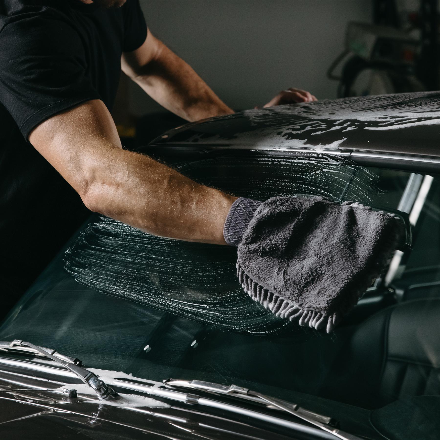 Applying pure shampoo to an Aston Martin DB5