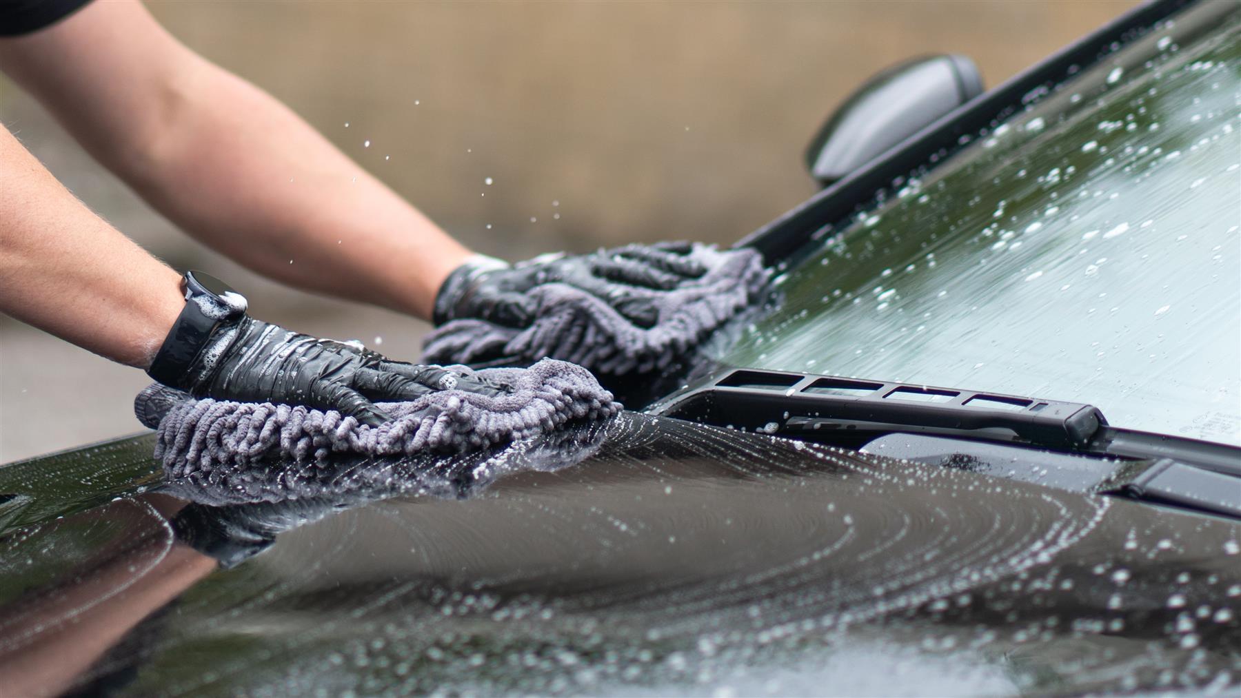 Using pure shampoo to clean an aston martin