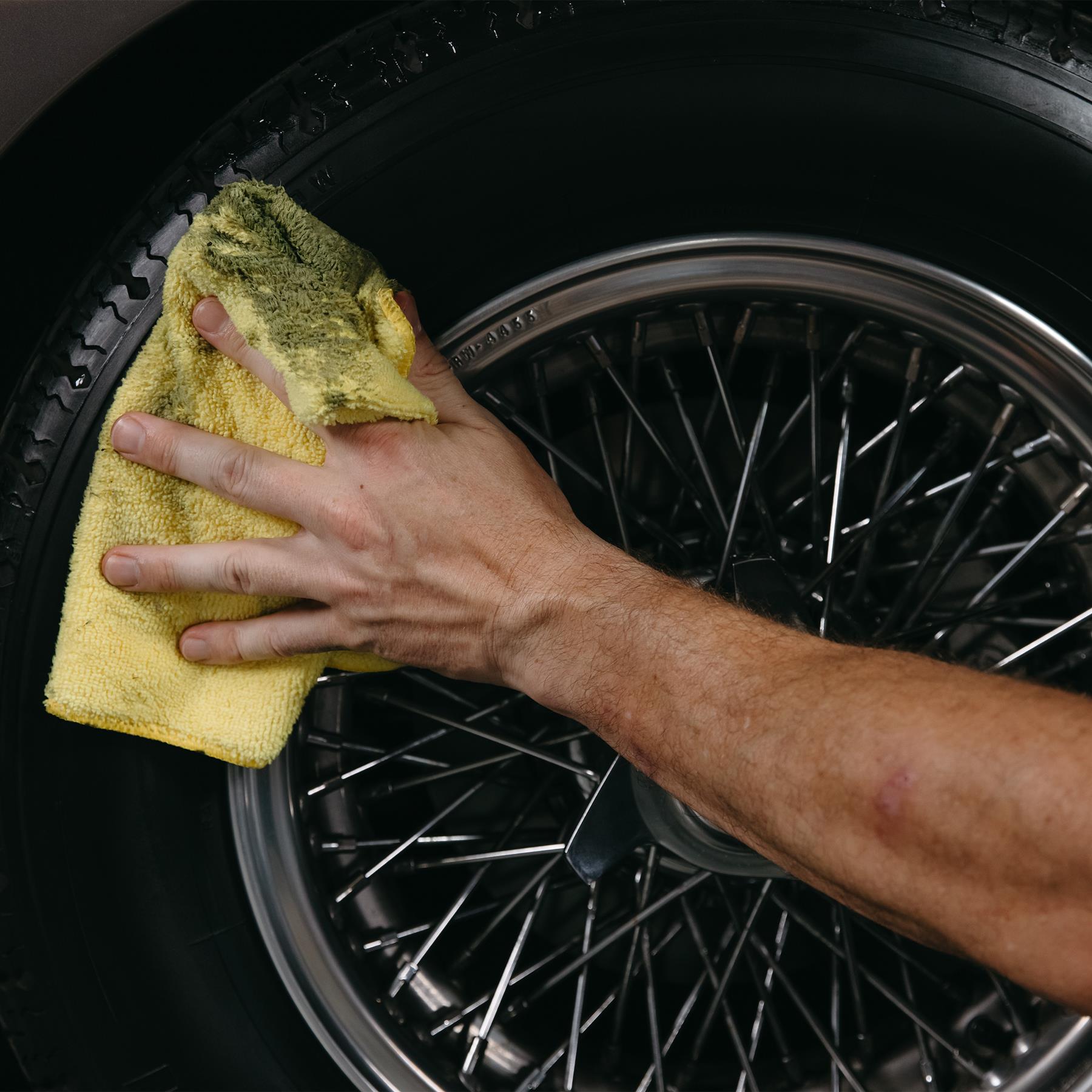 Tyre serum applied to wheel with a microfibre cloth
