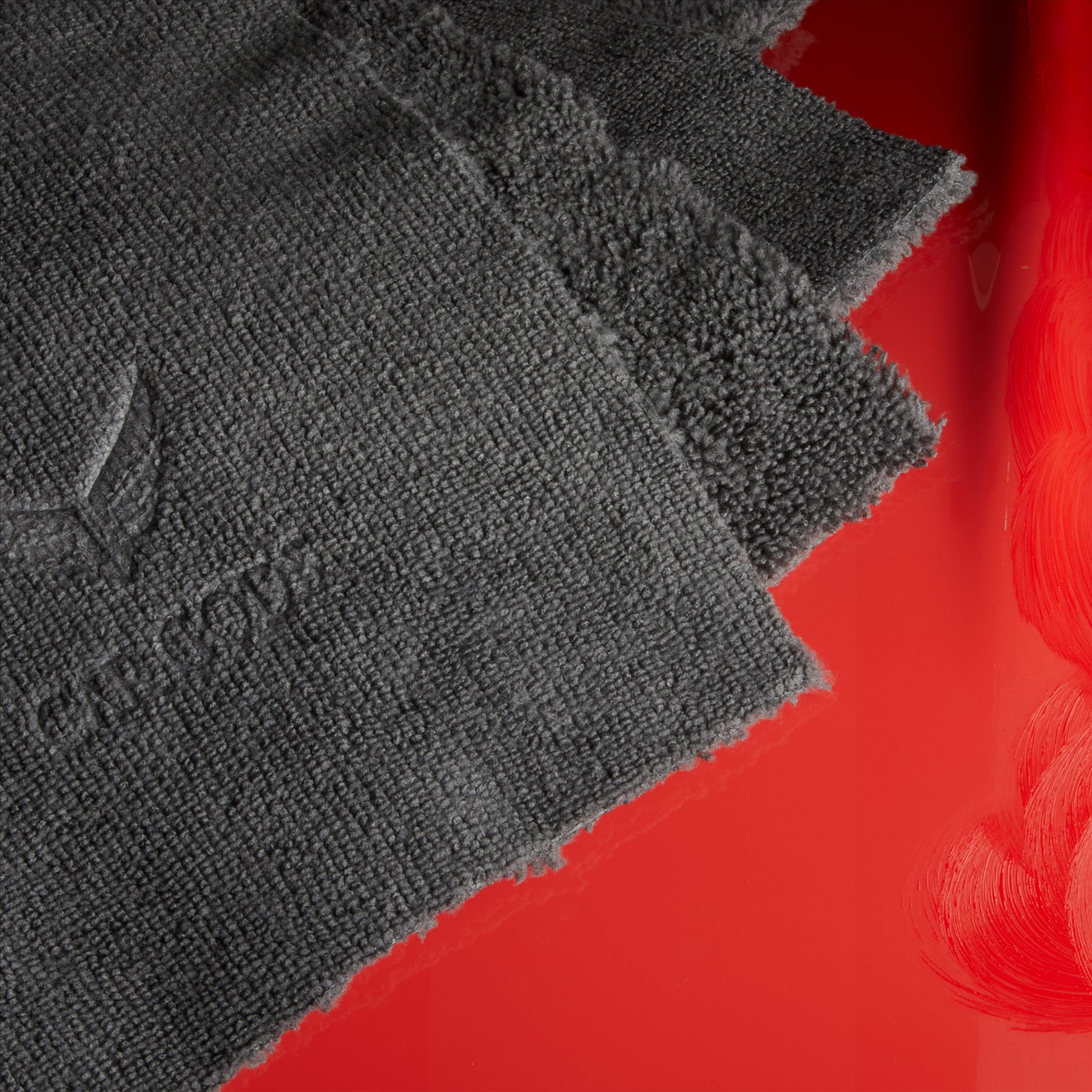Microfibre detailing cloth on a red bonnet