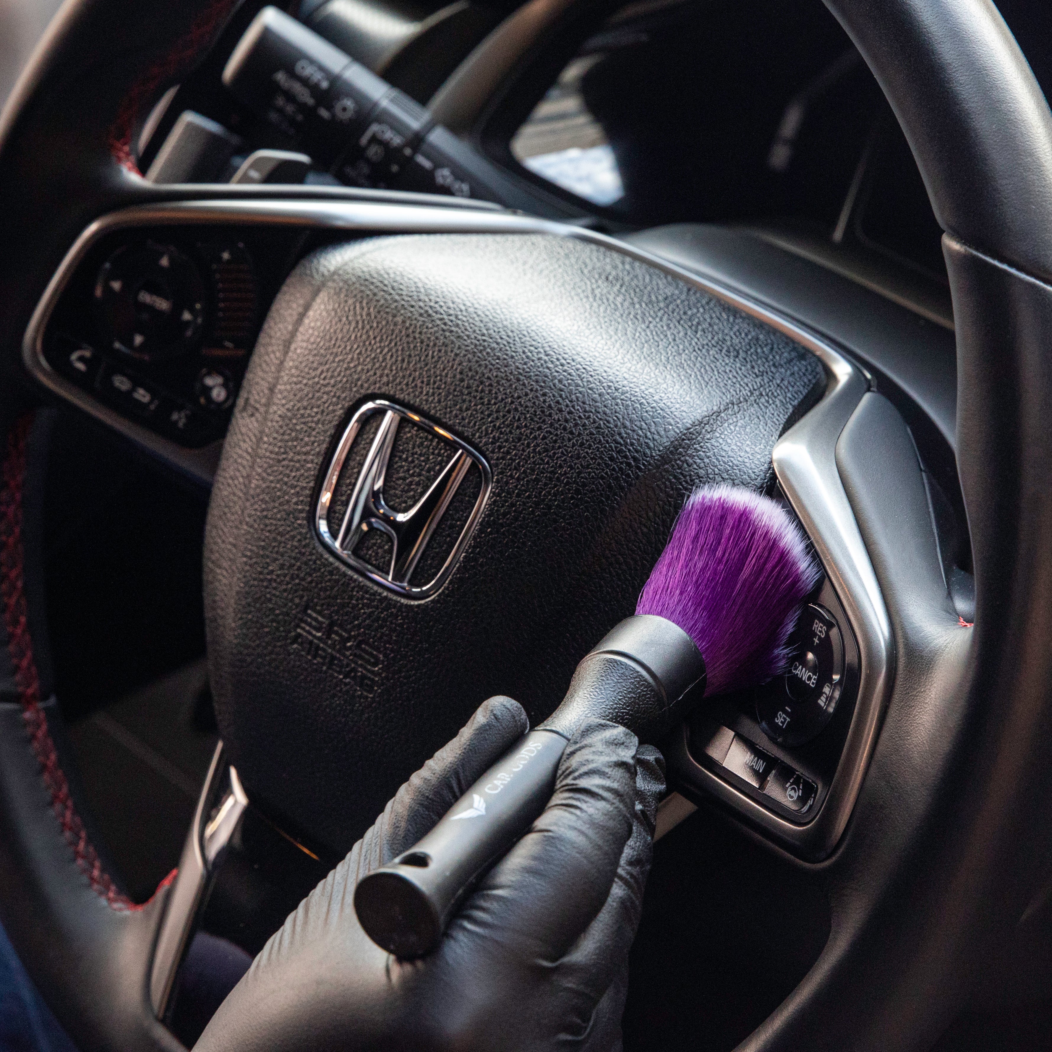 Small Bristles Reach Around Steering Wheel Buttons