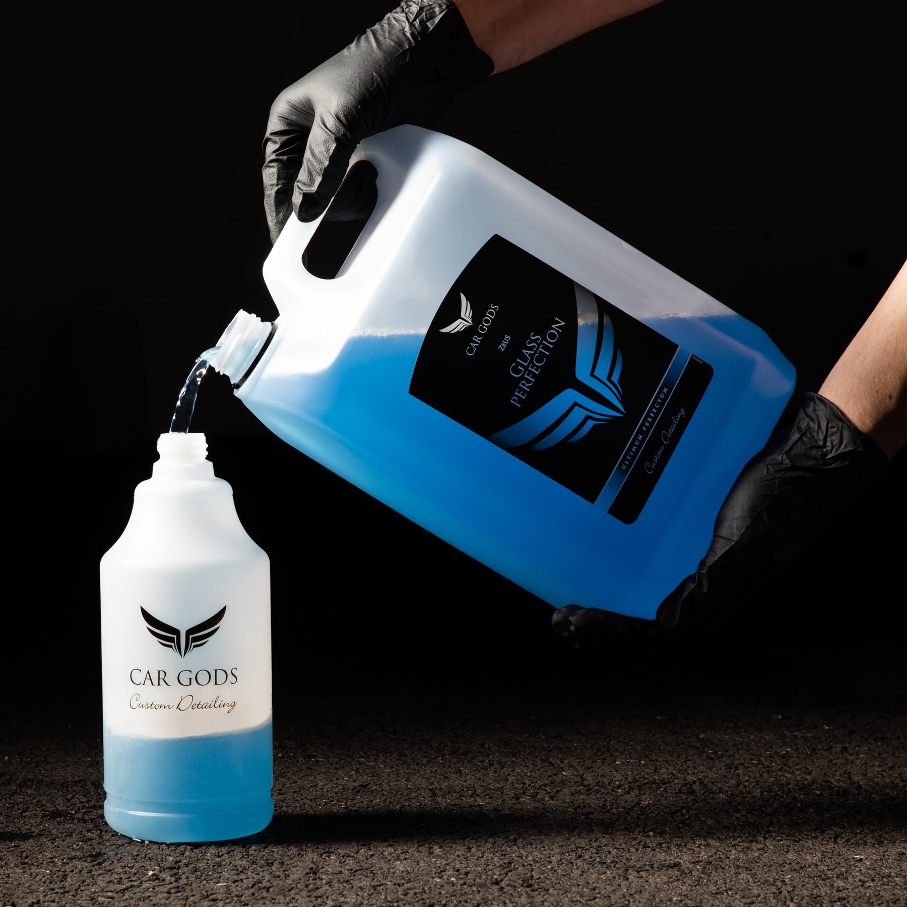 Pouring 5l glass perfection cleaner into professional spray bottle