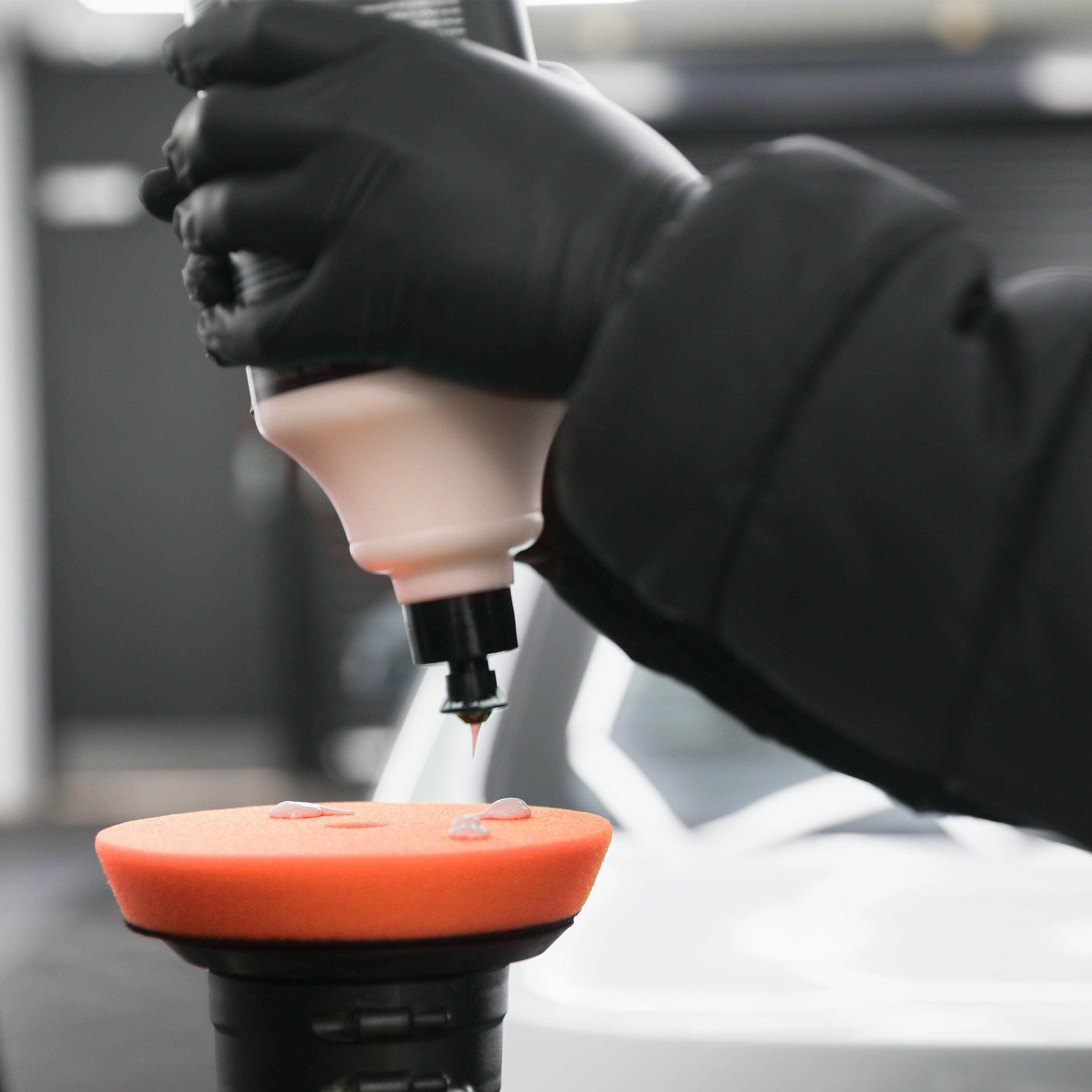 medium cutting compound being applied to polishing pad