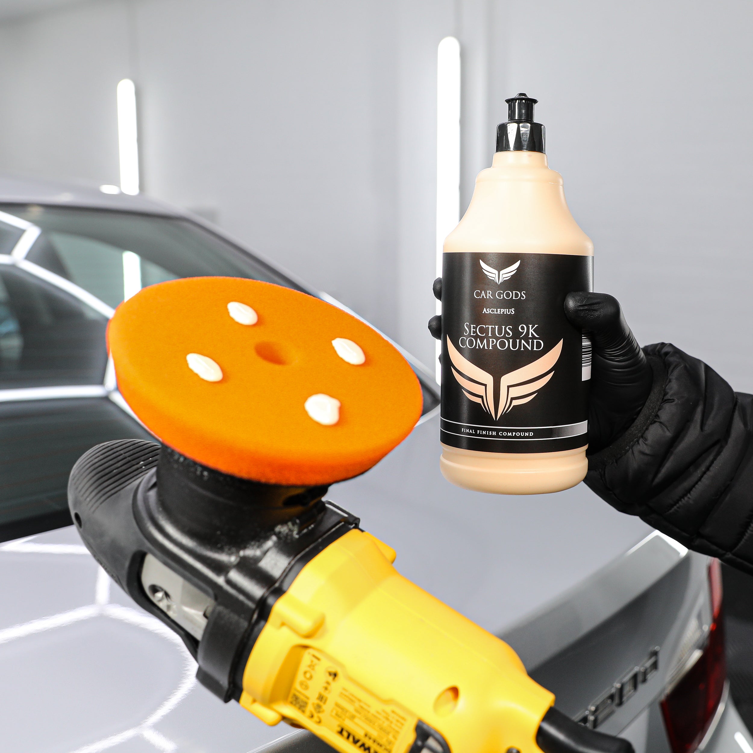 Medium cutting compound held next to dual action machine polisher