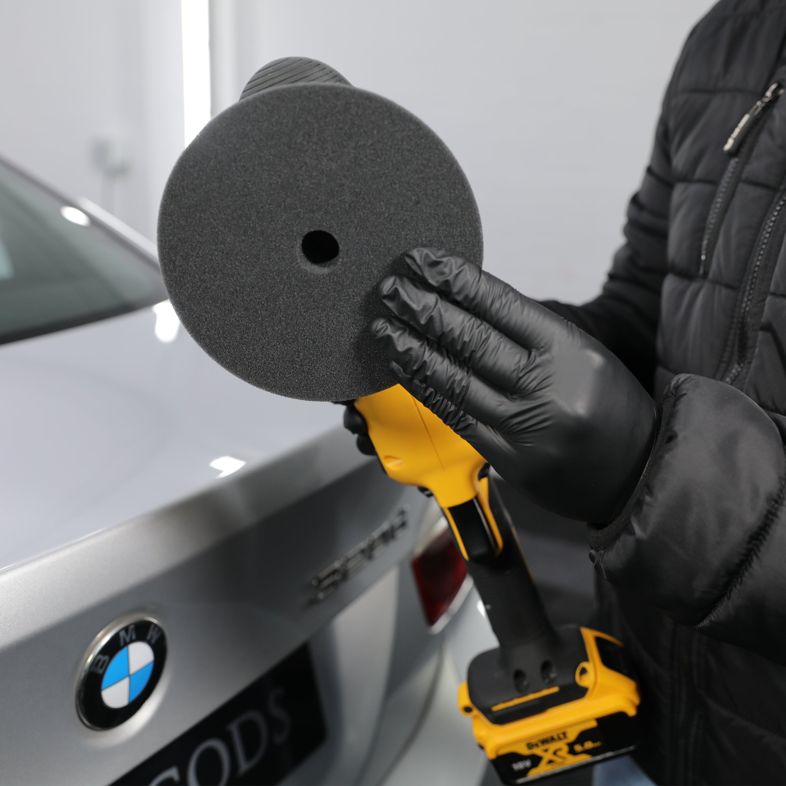 fine compound pad being attached to machine polisher