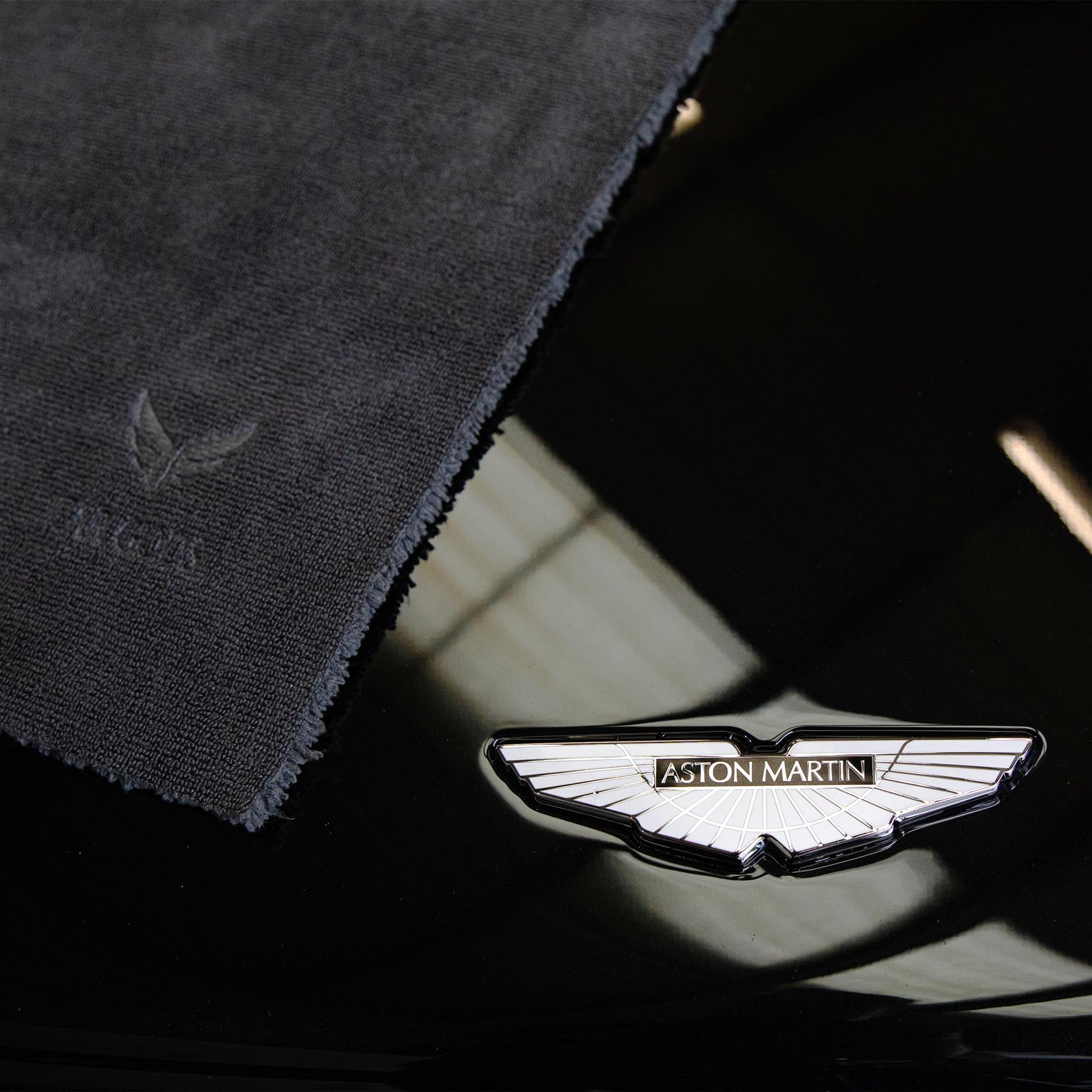 Microfibre cloth on a black car bonnet