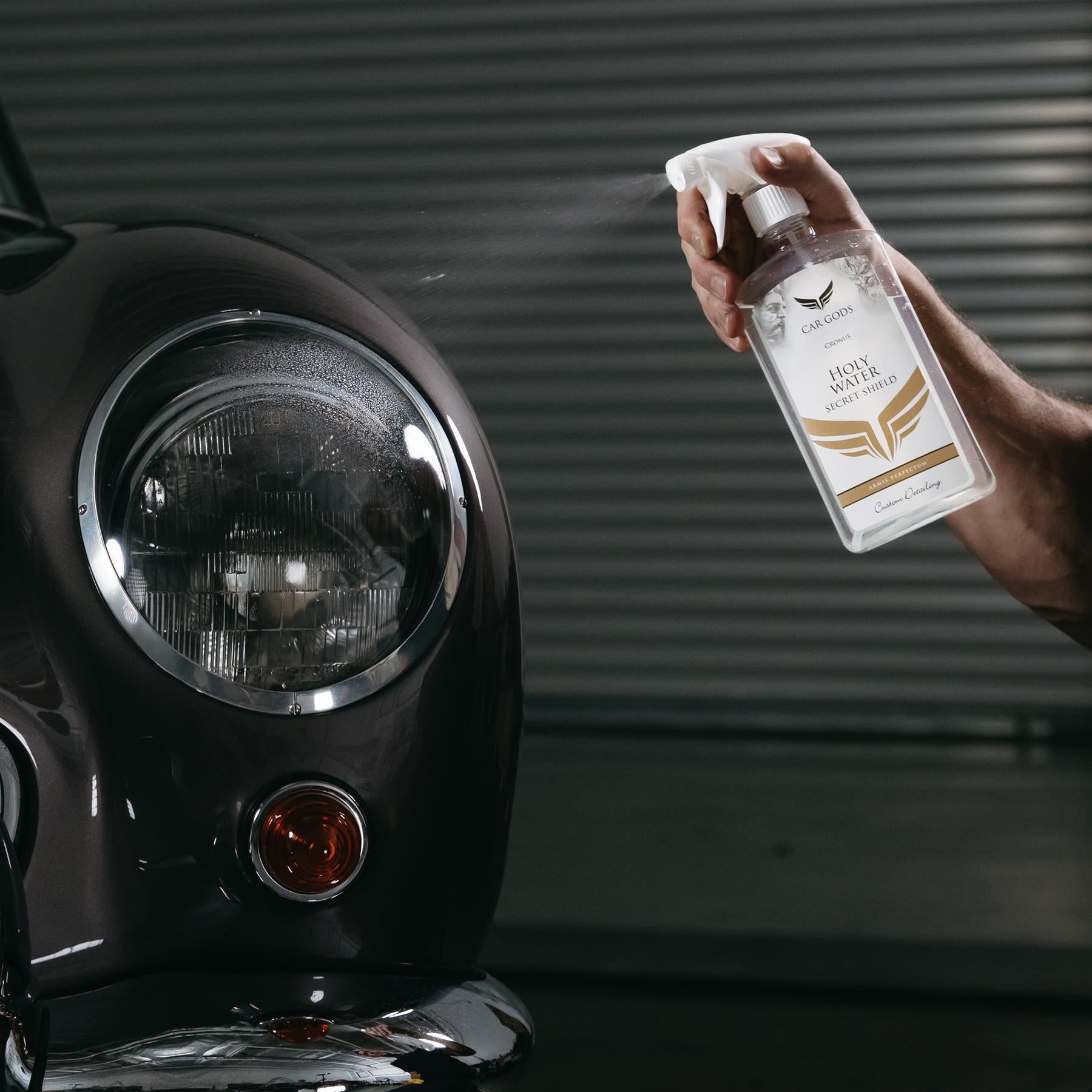 holy water paint sealant being sprayed on a car headlight