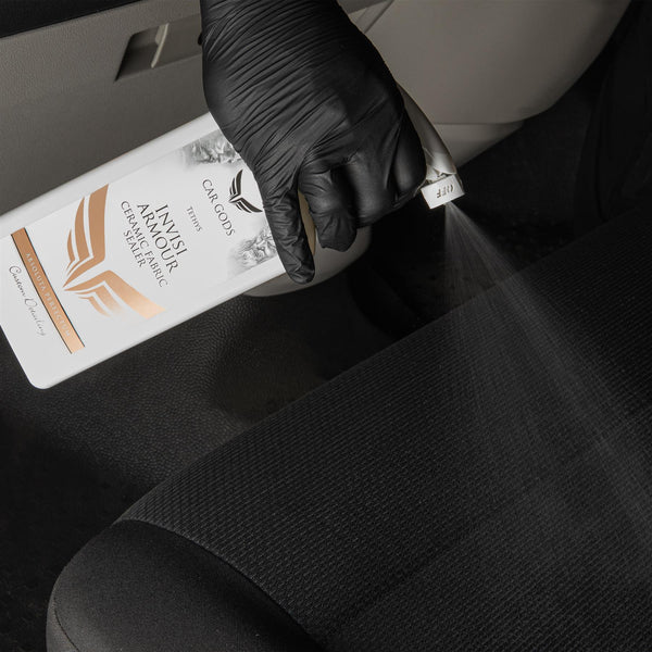 Spray ceramic fabric sealer directly onto car seats