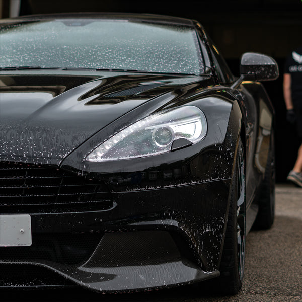 Aston Martin with bug and sap remover sprayed onto it