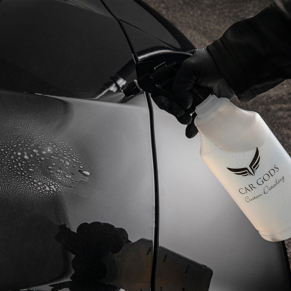 Spraying Holy Water Wax onto Car Bodywork