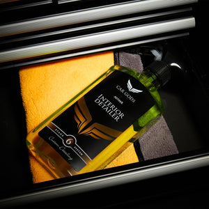 interior detailer bottle on a microfibre cloth