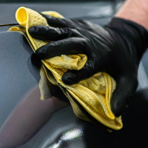 Microfibre cloth being used to dry a car