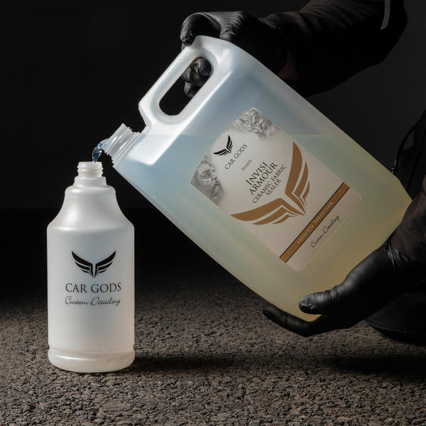Pouring Invisi Armour into a professional detailing bottle