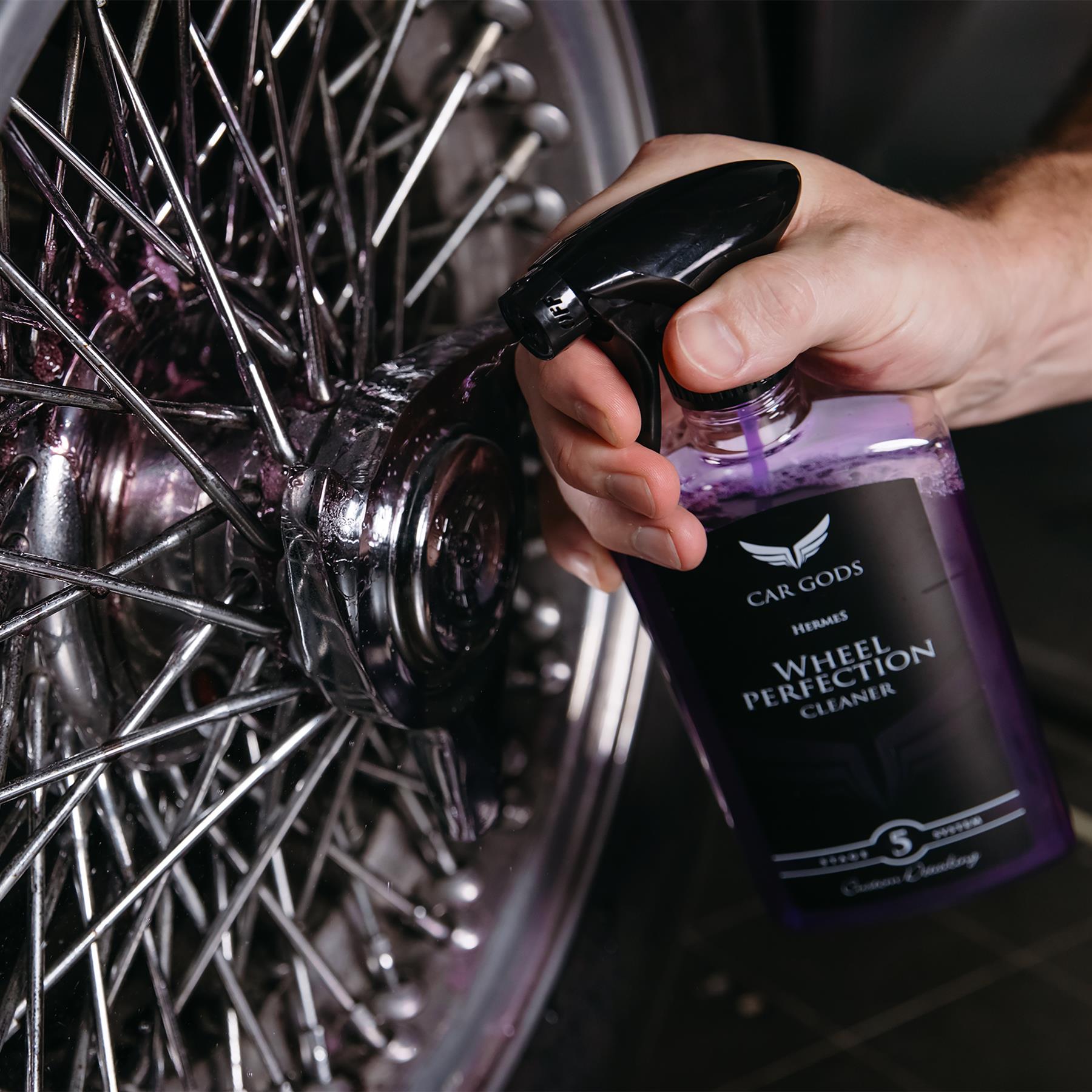 wheel cleaner being applied to a wire wheel
