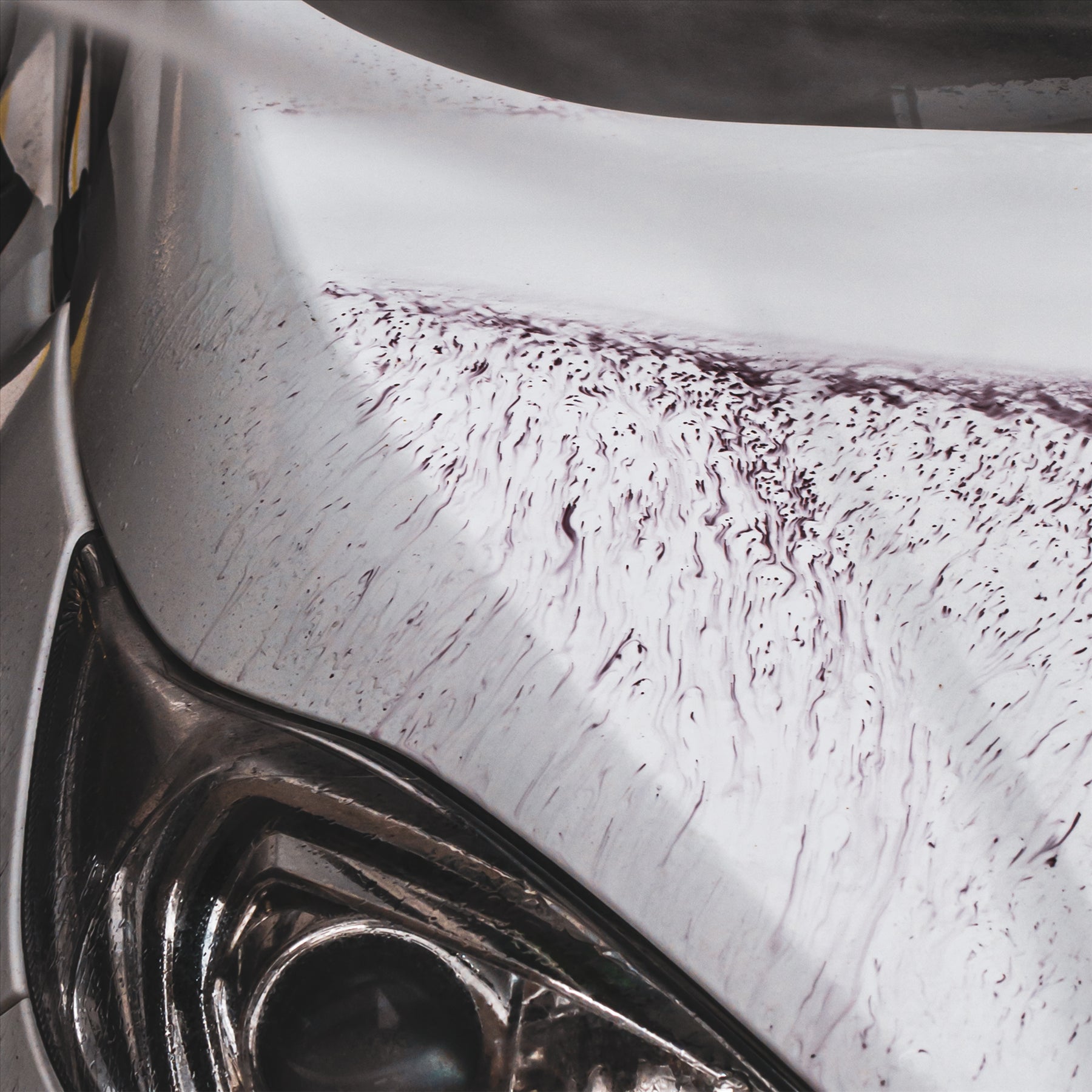 iron contaminants revealed on the front of a car